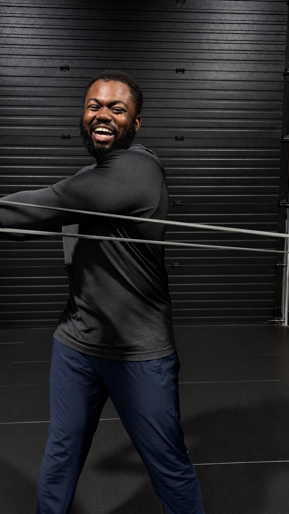 Doug laughing mid-set with a resistance band.